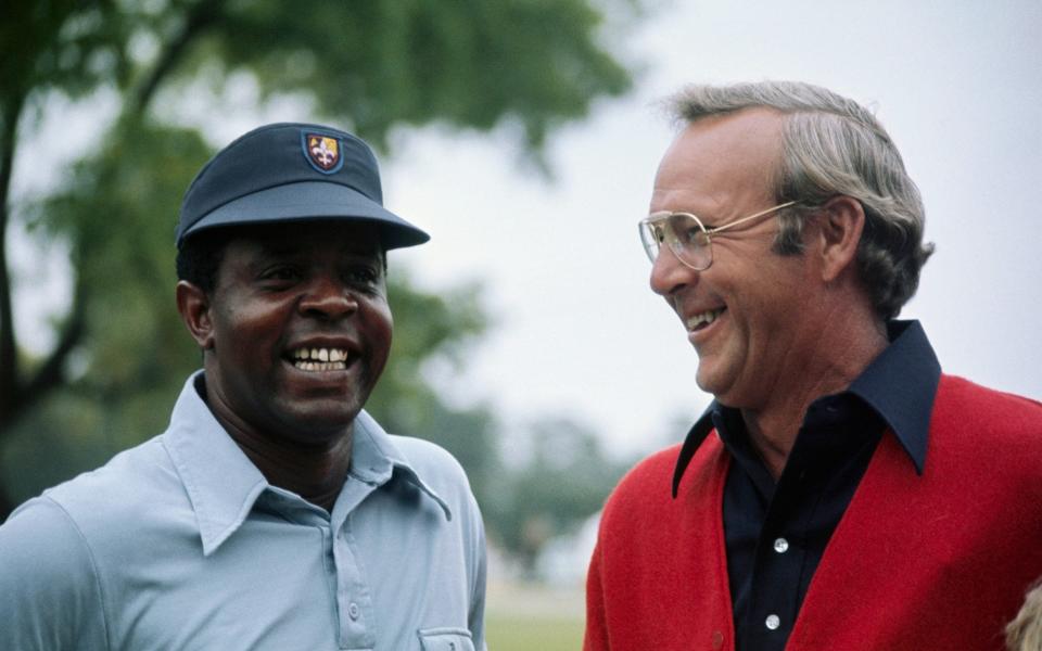  Lee Elder (L) and Arnold Palmer share a laugh during a recent tournament. Elder will be the first black to ever compete in the Masters Golf tourney. Lee elder gained his berth as the first black ever to compete in the Masters Golf Tournament by winning the Monastic Open, April 21, 1974. - BETTMAN