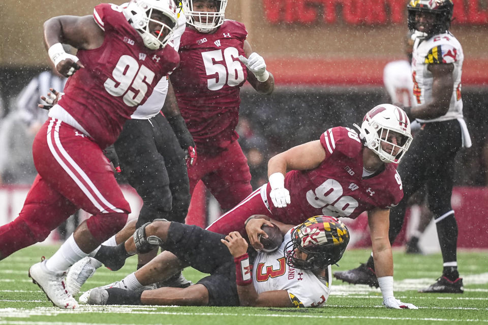 Wisconsin defensive end Isaiah Mullens (99) sacks Maryland quarterback Taulia Tagovailoa (3) during the first half of an NCAA college football game Saturday, Nov. 5, 2022, in Madison, Wis. (AP Photo/Andy Manis)