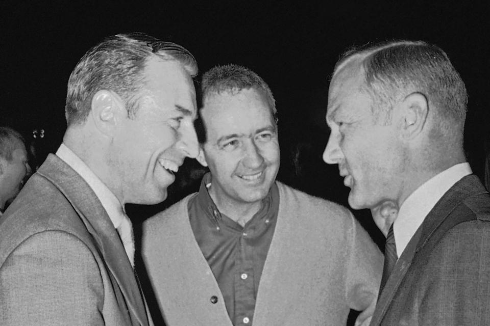 FILE - Apollo 13 commander James A. Lovell Jr., left, is greeted by Col. James A. McDivitt, center, and Col. Edwin "Buzz" Aldrin after the Apollo 13 crew arrived back home, Sunday, April 20, 1970, in Houston. McDivitt, who commanded the Apollo 9 mission testing the first complete set of equipment to go to the moon, died Thursday, Oct. 13, 2022. He was 93. (AP Photo/File)