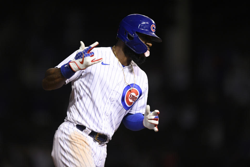 Chicago Cubs' Jason Heyward celebrates while rounding third base after hitting a game-winning, three-run home run against the Cincinnati in the 10th inning of a baseball game Wednesday, Sept. 8, 2021, in Chicago. The Cubs won 4-1. (AP Photo/Paul Beaty)