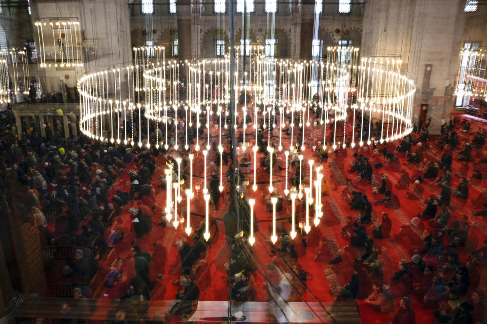 Muslim worshippers offer a pray at Suleymaniye mosque in Istanbul, Turkey, Friday, March 15, 2024. (AP Photo/Khalil Hamra)