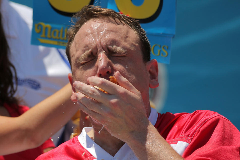 <p>Winner Joey Chestnut competes in Nathan’s Famous Fourth of July International Hot Dog-Eating Contest at Coney Island in Brooklyn, New York City, U.S., July 4, 2017. (Andrew Kelly/Reuters) </p>