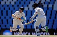 Cricket - New Zealand v South Africa - second cricket test match - Centurion Park, Centurion, South Africa - 29/8/2016. New Zealand's Henry Nicholls (L) and his captain, Kane Williamson, make a run. REUTERS/Siphiwe Sibeko