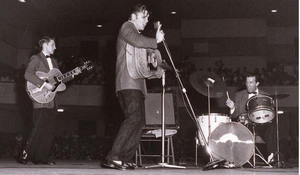 FILE - Elvis Presley performs for 6,000 screaming fans in the Bell Auditorium in Augusta in 1956. The interesting backstory of his 1968 comeback special will be explored in "Reinventing Elvis: The '68 Comeback."