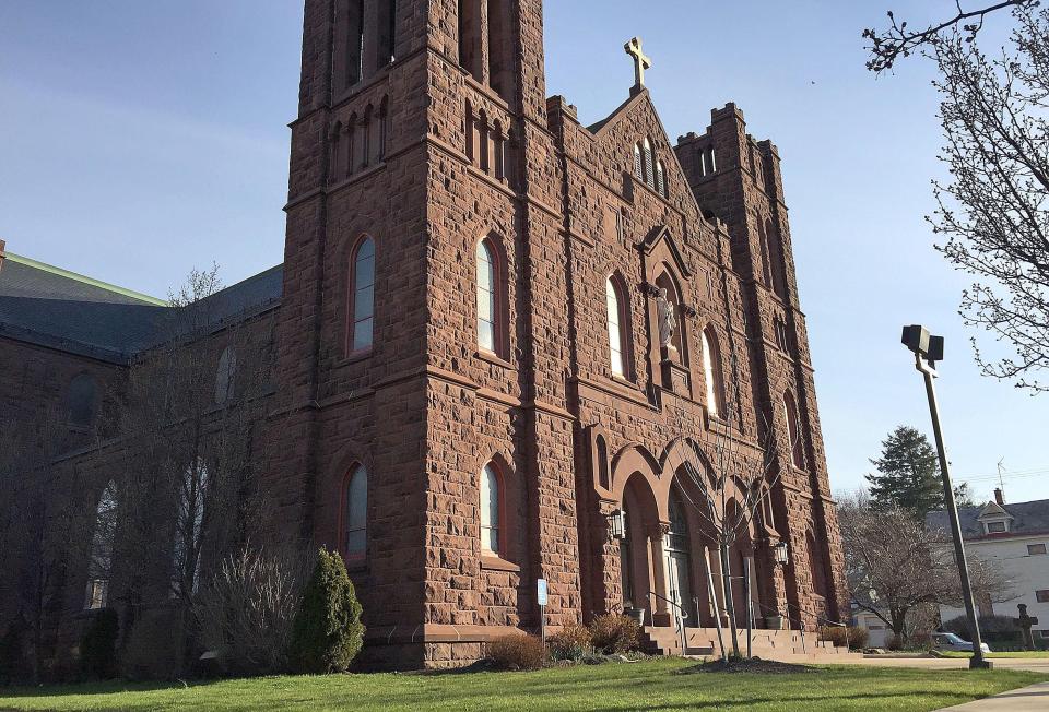 St. Andrew Parish, shown at 1116 W. Seventh St., will merge into St. Jude the Apostle Parish, 2801 W. Sixth St., as part of a restructuring in the Catholic Diocese of Erie.