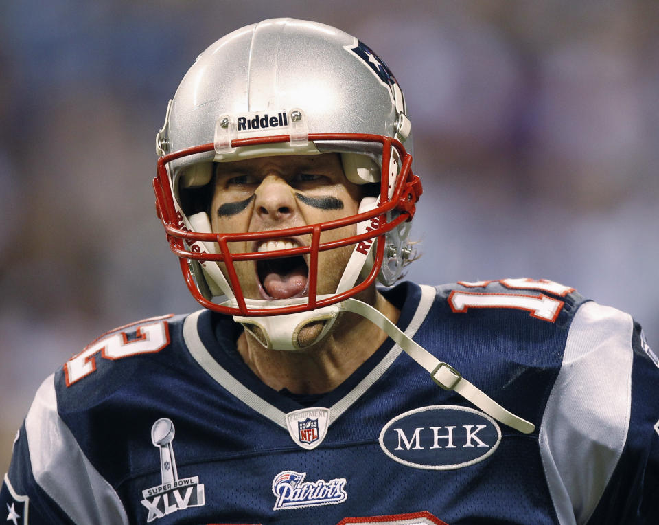 FILE - New England Patriots quarterback Tom Brady reacts after passing to Danny Woodhead for a touchdown during the first half of the NFL Super Bowl XLVI football game against the New York Giants, Feb. 5, 2012, in Indianapolis. Brady, the seven-time Super Bowl winner with New England and Tampa Bay, announced his retirement from the NFL on Wednesday, Feb. 1, 2023 exactly one year after first saying his playing days were over, by posting a brief video lasting just under one minute on social media. (AP Photo/Paul Sancya, file)