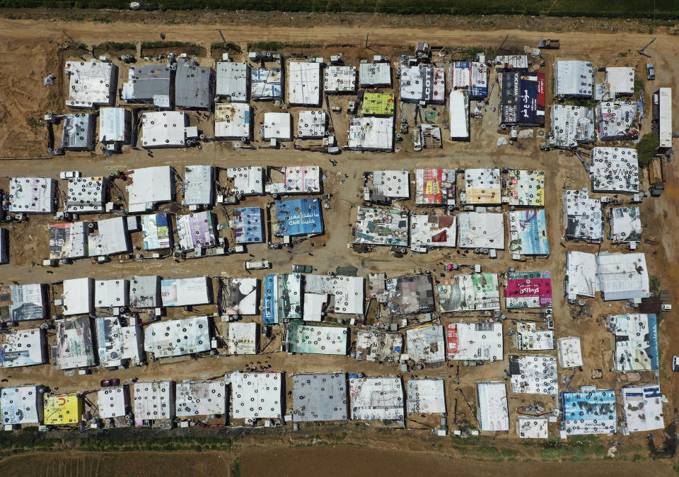 FILE - A general view of an informal Syrian refugee camp, in the Bekaa valley town of Saadnayel, east Lebanon, April 23, 2019. Against the backdrop of a worsening economic crisis and political stalemate, Lebanese officials have launched a crackdown on the country's Syrian refugees. (AP Photo/Hussein Malla, File)