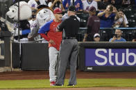 Philadelphia Phillies manager Joe Girardi, left, argues with umpire Carlos Torres during the seventh inning of a baseball game, Friday, Sept. 17, 2021, in New York. (AP Photo/Mary Altaffer)