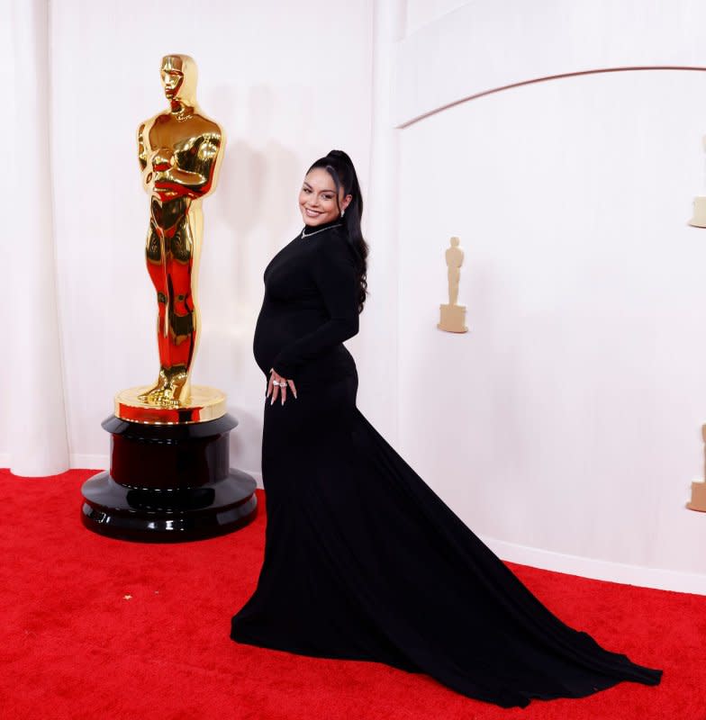 Vanessa Hudgens arrives on the red carpet at the 96th annual Academy Awards in Los Angeles on Sunday. Photo by John Angelillo/UPI