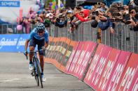 Richard Carapaz pedals on his way to win the 14th stage of the Giro d'Italia cycling race, from Saint-Vincent to Courmayeur, Saturday, May 25, 2019. Richard Carapaz of Ecuador won the grueling 14th stage of the Giro d'Italia on Saturday to move into the overall lead. (Alessandro Di Meo/ANSA via AP)
