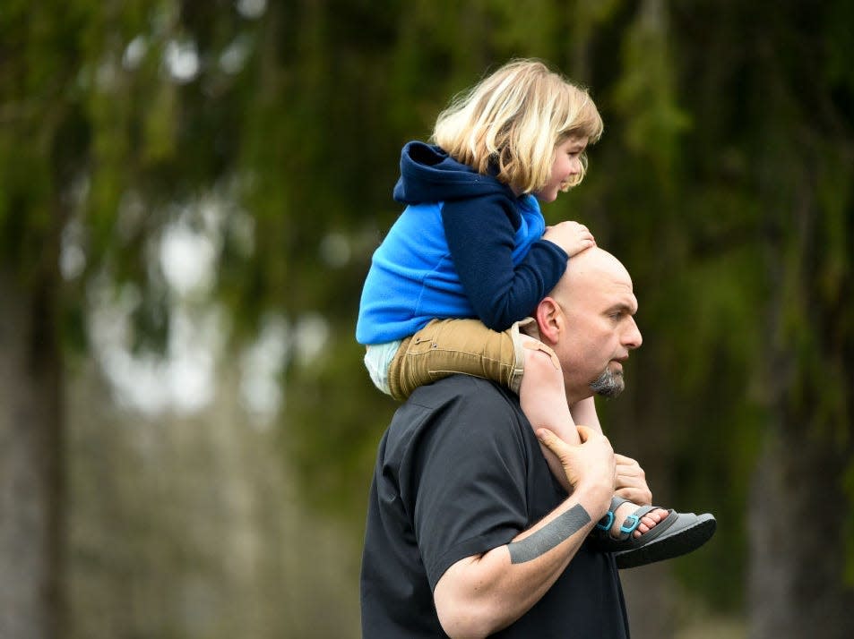 John Fetterman holds his son August on his shoulders