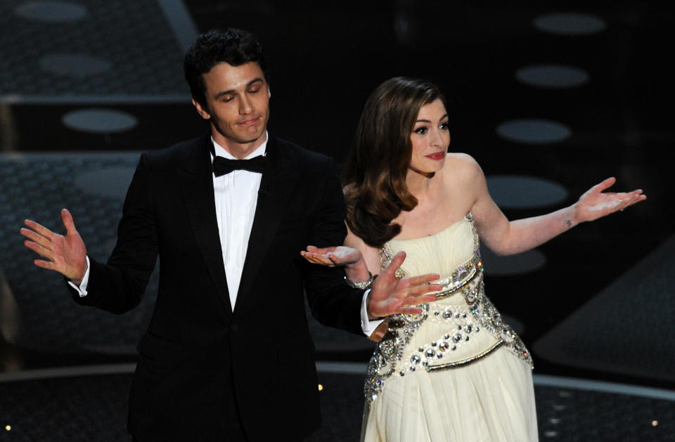 James Franco and Anne Hathaway introduce veteran actor Kirk Douglas onstage at the Academy Awards at the Kodak Theatre on Feb. 27, 2011, in Hollywood, California. / Credit: Gabriel Bouys/AFP via Getty Images