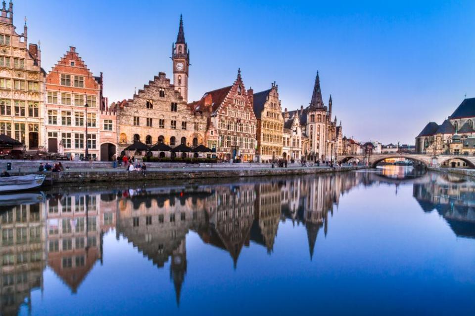 Medieval buildings overlooking the Graslei harbor on Leie River in Ghent town, Belgium, Europe.