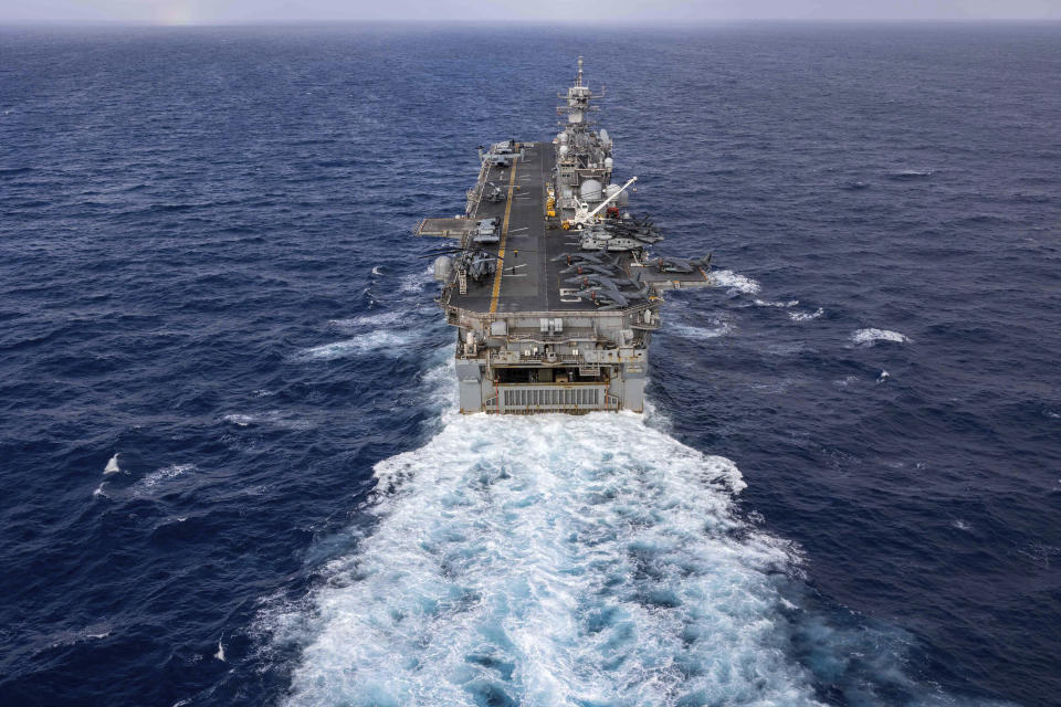 In this handout photo from the U.S. Navy, the Wasp-class amphibious assault ship USS Bataan travels through Atlantic Ocean on July 20, 2023. Thousands of Marines backed by the United States' top fighter jet, warships and other aircraft are slowly building up in the Persian Gulf. It's a sign that while America's wars in the region may be over, its conflict with Iran over its advancing nuclear program only continues to worsen with no solutions in sight. (Mass Communication Specialist 2nd Class Danilo Reynoso/U.S. Navy, via AP)