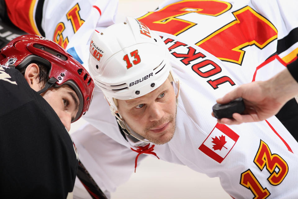 GLENDALE, AZ - MARCH 01: Olli Jokinen #13 of the Calgary Flames faces off against Boyd Gordon #15 of the Phoenix Coyotes during the NHL game at Jobing.com Arena on March 1, 2012 in Glendale, Arizona. The Flames defeated the Coyotes 4-2. (Photo by Christian Petersen/Getty Images)