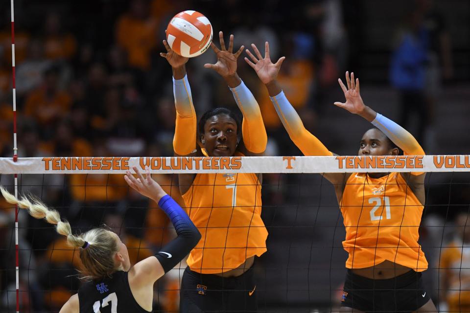 Tennessee right side hitter Morgahn Fingall (7) and middle blocker Danielle Mahaffey (21) block a hit by Kentucky outside hitter Alli Stumler (17) in an NCAA volleyball match between the Tennessee Lady Vols and Kentucky Wildcats in Knoxville, Tenn. on Wednesday, October 27, 2021.