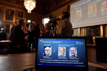 The names of Rainer Weiss, Barry C. Barish, Kip S. Thorne are displayed on the screen during the announcement of the winners of the Nobel Prize in Physics 2017, in Stockholm, Sweden, October 3, 2017. TT News Agency/Jessica Gow via REUTERS