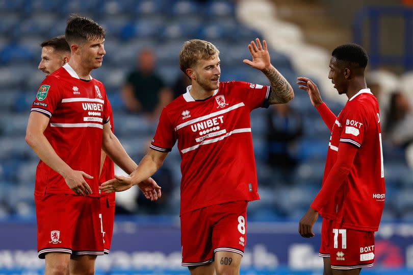 Paddy McNair, Riley McGree and Isaiah Jones celebrate