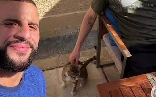 Kyle Walker with Dave the cat
