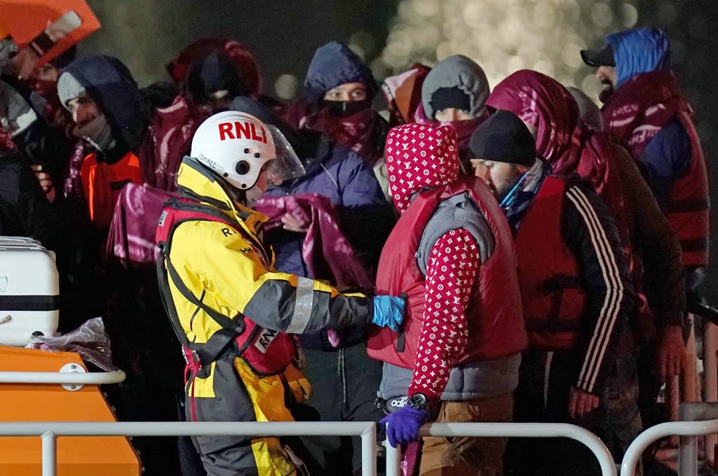 A group of people thought to be migrants are brought in to Dover, Kent, by the RNLI, on Thursday (Gareth Fuller/PA) (PA Wire)