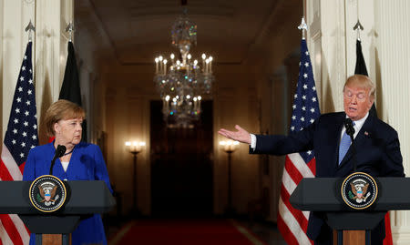 FILE PHOTO: U.S. President Donald Trump and Germany's Chancellor Angela Merkel hold a joint news conference in the East Room of the White House in Washington, U.S., April 27, 2018. REUTERS/Kevin Lamarque/File Photo