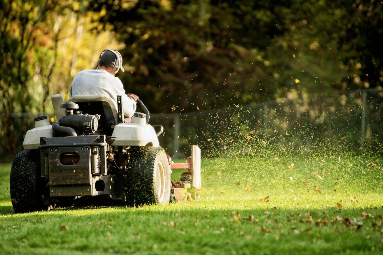 man mowing lawn