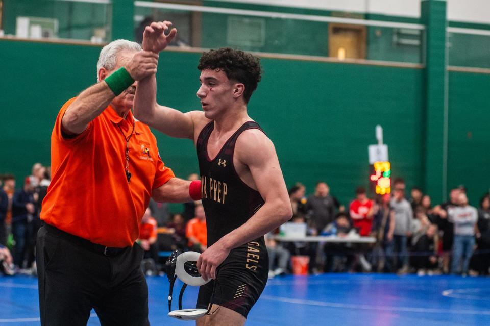 Iona Prep's Vincent Tripaldi, right, wins his match against Averill Park's Jacob Hanlon in the 131 pound weight class during Eastern States Classic wrestling at SUNY Sullivan in Loch Sheldrake, NY on Friday, January 12, 2024. KELLY MARSH/FOR THE JOURNAL NEWS