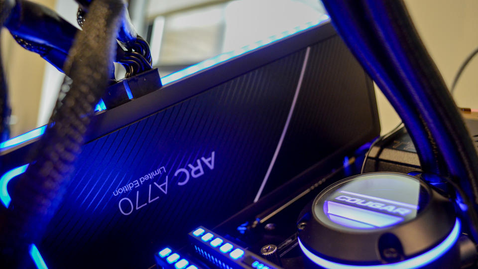 An Intel Arc A770 LE graphics card on a table with a pink desk mat