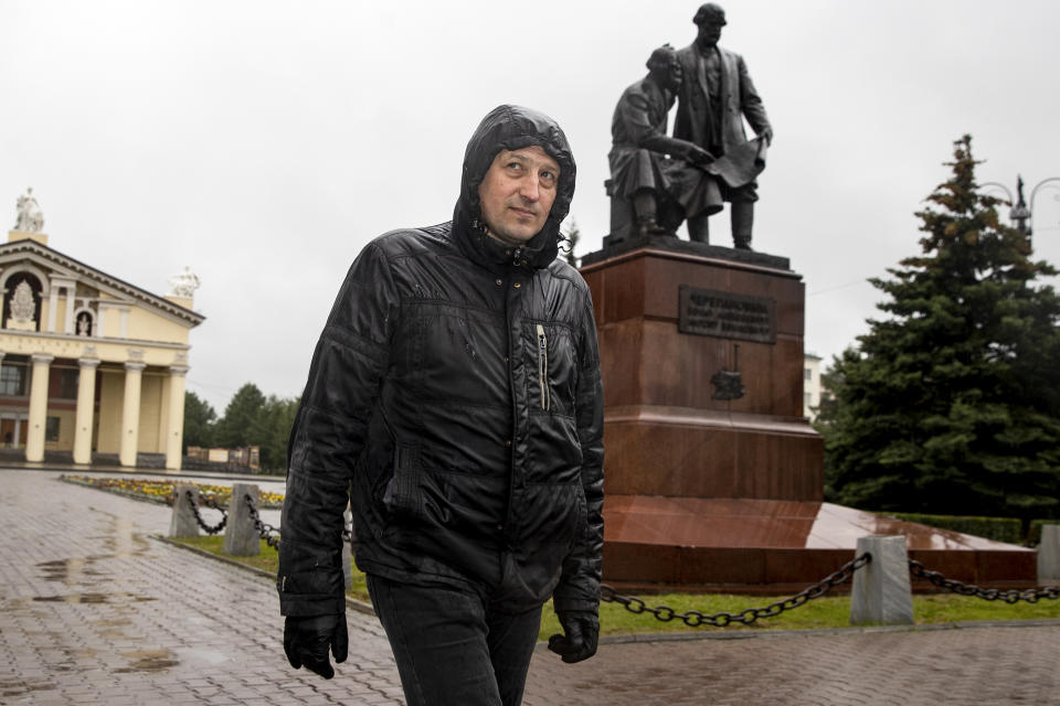 In this photo taken on Sunday, June 28, 2020, Nikolay Nemytov, a 43-year-old worker at Russian Railways, walks past a monument to local inventors and engineers after his interview with The Associated Press in Nizhny Tagil, Russia. Workers in the city 1,400 kilometers (870 miles) east of Moscow that once was seen as a Putin stronghold are speaking out against the constitutional reforms that would allow him to stay in office until 2036. They are frustrated over dire living conditions that have not improved during his tenure. “I am against the constitutional changes, most importantly because they are a coronation of the czar, who reigns but does not rule — Vladimir Vladimirovich Putin,” says Nemytov. He says his monthly salary, the equivalent of $430, is not nearly enough. (AP Photo/Anton Basanayev)