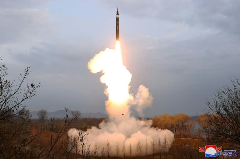 North Korea's official Korean Central News Agency shows the first test-fire of a new-type intermediate-range solid-fueled ballistic missile (STR)