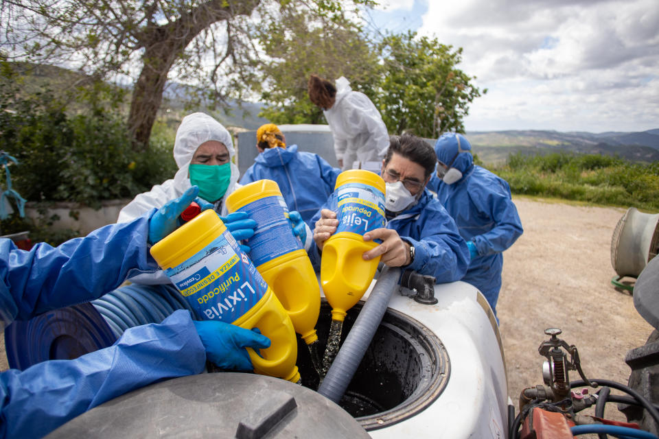 ZAHARA DE LA SIERRA, SPAIN - APRIL 20: Volunteers prepare to disinfect the town during the coronavirus pandemic on April 20, 2020 in Zahara de la Sierra, Spain. Zahara has mostly cut itself off to the outside world since March 14, a decision broadly supported by its residents, many of whom are elderly. Nearly a quarter of Zahara's inhabitants are older than 65, a demographic group at greater risk of COVID-19. (Photo by Juan Carlos Toro/Getty Images)