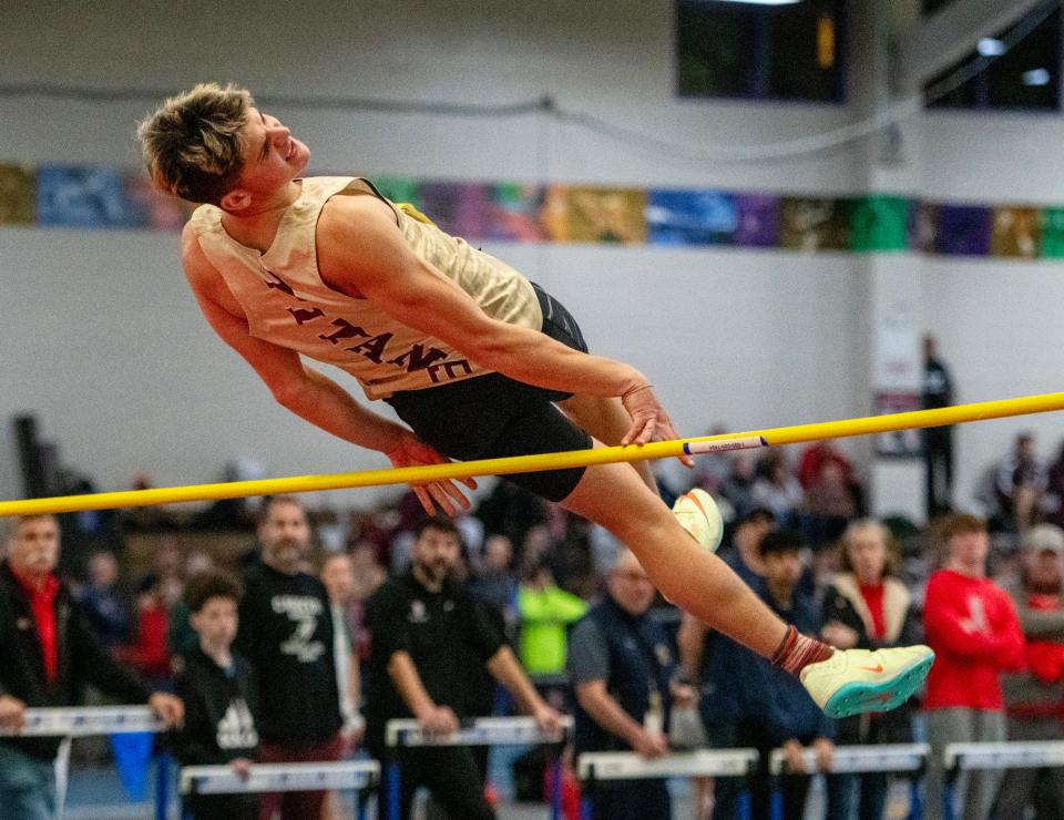 BOSTON - Algonquin’s Miles Lipka hits the bar on his last jump during the indoor track and field championship Saturday at the Reggie Lewis Center.