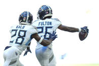 Tennessee Titans cornerback Kristian Fulton celebrates a recovered a fumble in front of teammate Joshua Kalu in the second half of an NFL football game against the Indianapolis Colts in Indianapolis, Fla., Sunday, Oct. 2, 2022. (AP Photo/AJ Mast)