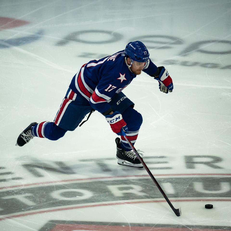 Sean Malone (17) advances the puck against the Utica Comets during the 2022 Calder Cup Playoffs on Saturday, May 14, 2022 at the Adirondack Bank Center in Utica.