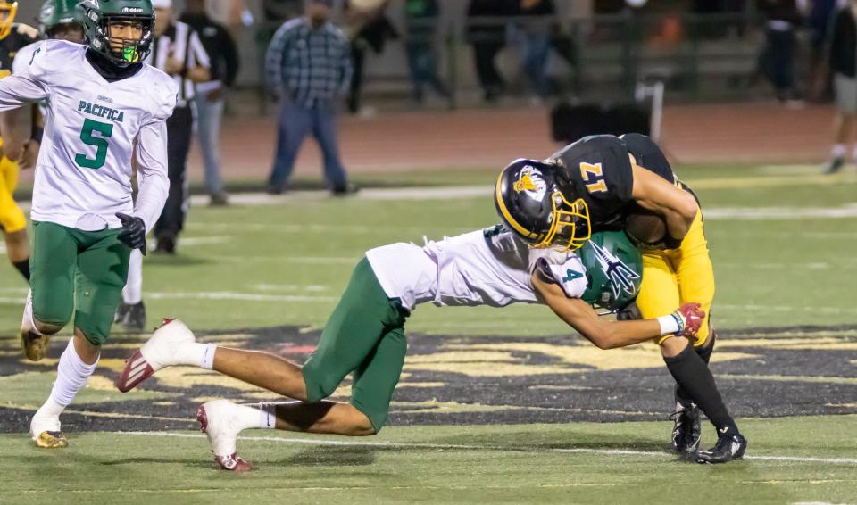 Pacifica's Dayday Aupiu tackles Ventura's Sawyer Cline during the Tritons' 49-0 win on Friday, Sept. 23, 2022.