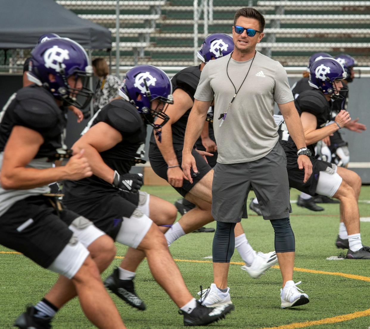 Holy Cross football coach Bob Chesney watches over a practice earlier this season.