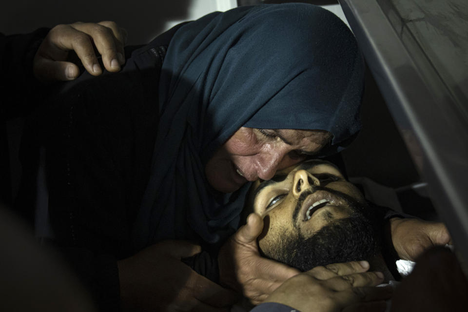 A Palestinian woman mourns Mohammed Abu Taima, killed in an Israeli airstrike, in Khan Younis in the Gaza Strip, Wednesday, May 10, 2023. Israeli authorities say Palestinian militants in the Gaza Strip have launched rockets toward southern Israel. Wednesday's launch comes a day after Israeli airstrikes killed three militant leaders and at least 10 civilians. (AP Photo/Fatima Shbair)