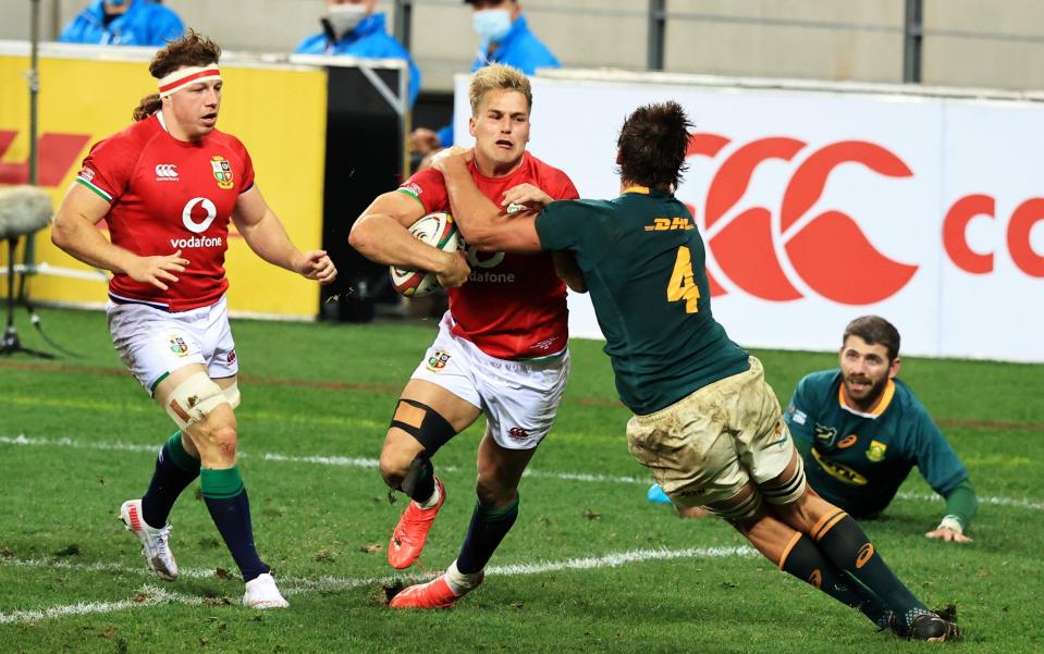 Duhan Van Der Merwe of British & Irish Lions is tackled short of the line by Eben Etzebeth of South Africa during the 1st Test between South Africa & British & Irish Lions at Cape Town Stadium on July 24, 2021 in Cape Town, South Africa. - GETTY IMAGES
