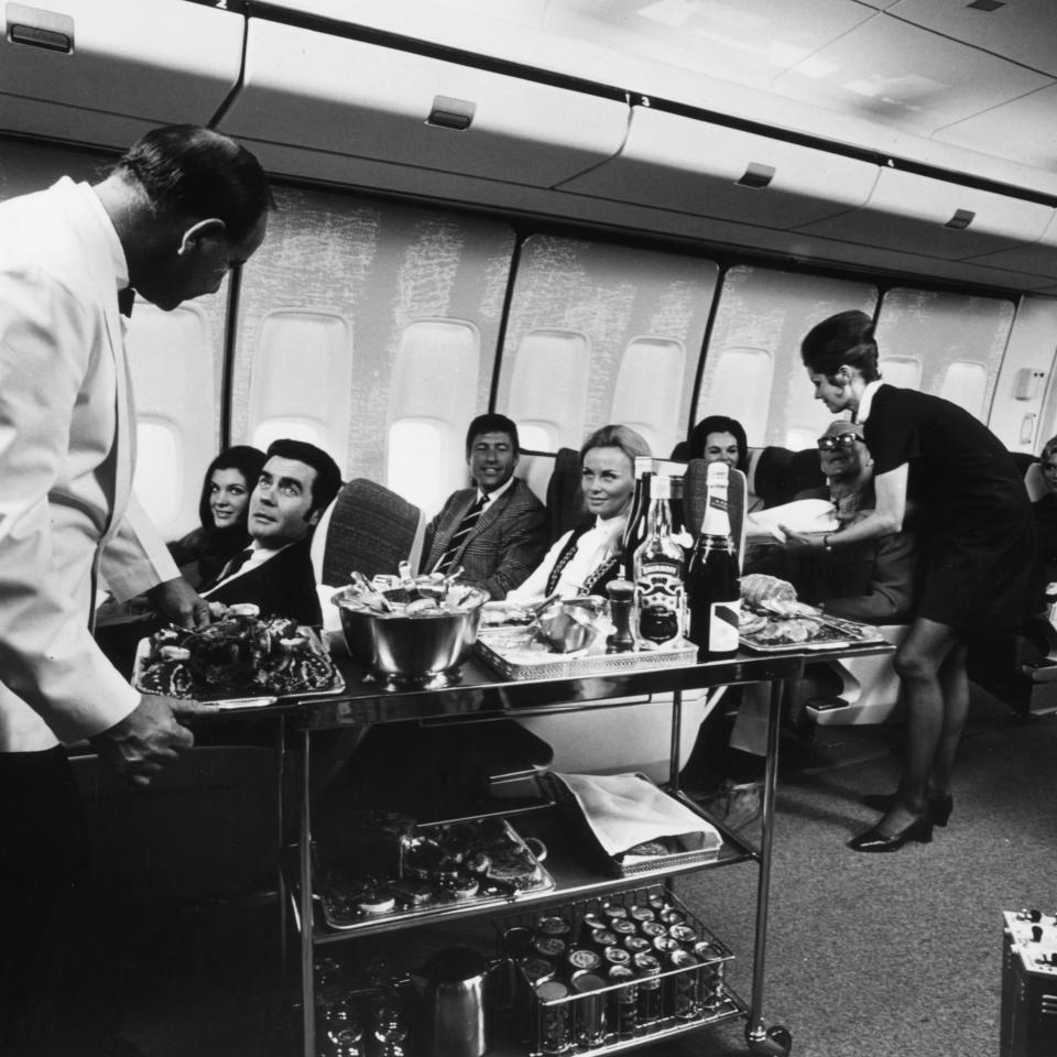 Drinks are served to 747 passengers in 1970 - Getty