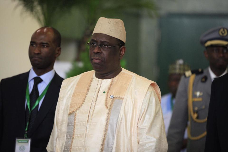 Senegal's President Macky Sall arrives for a summit to address a seminar on security during an event marking the centenary of the unification of Nigeria's north and south in Abuja, Nigeria, Thursday, Feb. 27, 2014. (AP Photo / Sunday Alamba)