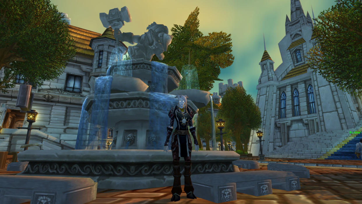  WoW Cataclysm transmog - a draenei is standing in Stormwind city next to fountain. 