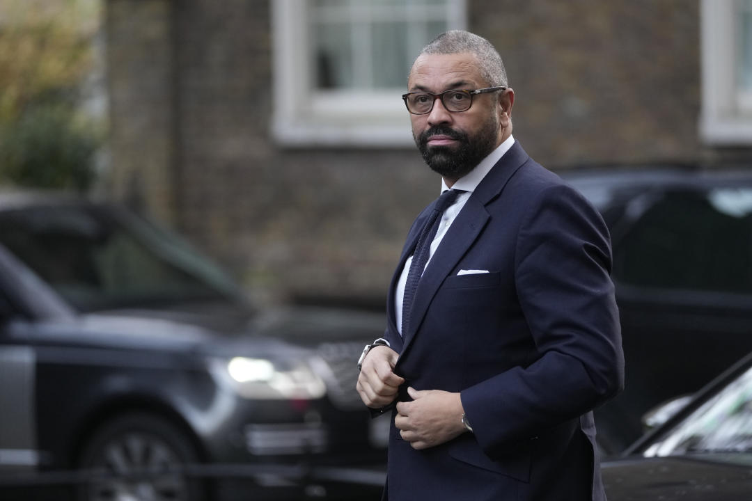 James Cleverly Secretary of State for the Home Department arrives for a Cabinet meeting at Downing Street in London, Tuesday, Dec. 12, 2023. Prime Minister Rishi Sunak is racing to persuade lawmakers to back his Rwanda migration bill in a key vote later Tuesday. (AP Photo/Kin Cheung)