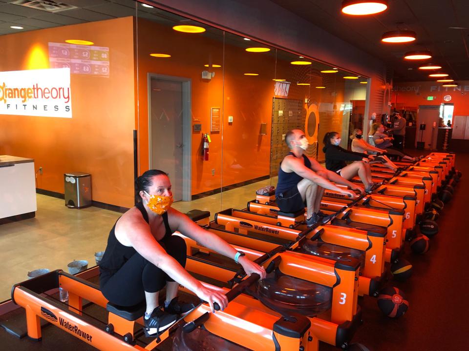 Classes at reopened Orangetheory studios are held at limited capacity to allow for social distancing. The classes are "mask optional."