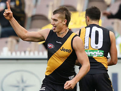 Dustin Martin of the Tigers celebrates a goal during the round 12 AFL match between the Richmond Tigers and the Adelaide Crows at Melbourne Cricket Ground on June 15, 2013 in Melbourne, Australia.