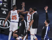 New York Knicks guard Immanuel Quickley (5) celebrates with forward Reggie Bullock (25) after making a 3-point basket against the Atlanta Hawks in overtime of an NBA basketball game Wednesday, April 21, 2021, in New York. (Wendell Cruz/Pool Photo via AP)