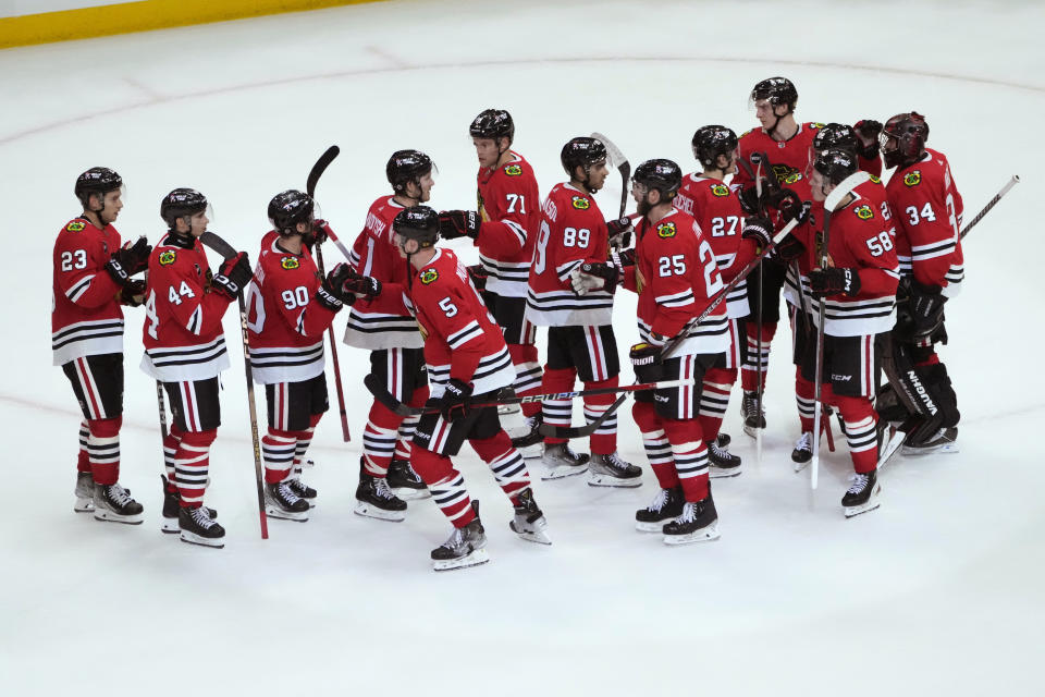 The Chicago Blackhawks celebrate a win over the Florida Panthers in an NHL hockey game Saturday, Nov. 4, 2023, in Chicago. (AP Photo/Charles Rex Arbogast)