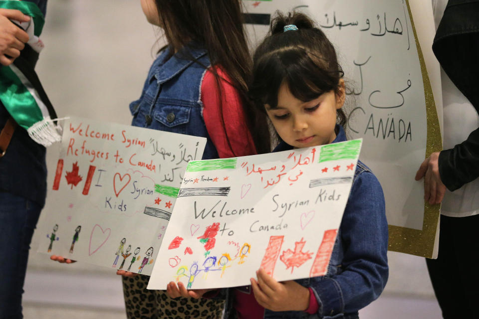 Maryam and Nore Kasmeih wait for Syrian refugees at the airport. Their mother came to Canada 15 years ago, and their family that was in Syria has fled to Turkey.