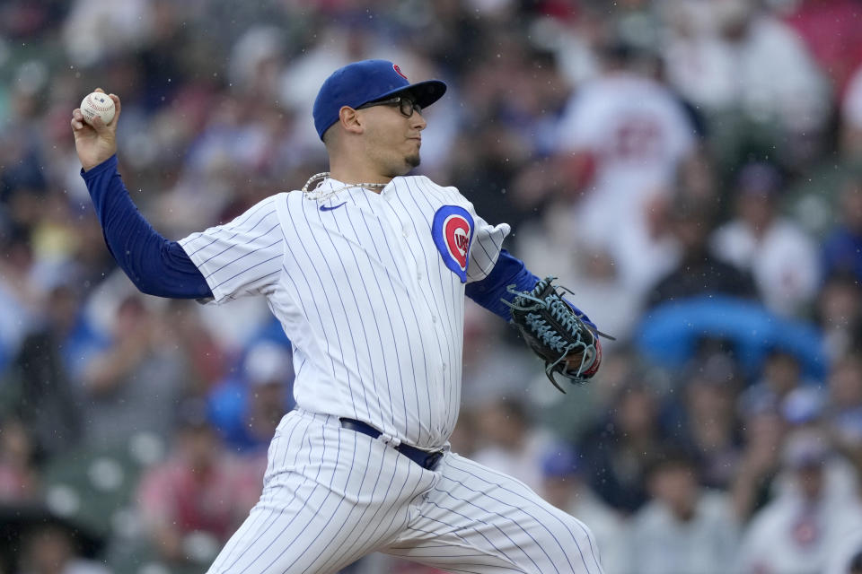 Chicago Cubs starting pitcher Javier Assad delivers during the first inning of a baseball game against the Atlanta Braves, Saturday, Aug. 5, 2023, in Chicago. (AP Photo/Charles Rex Arbogast)