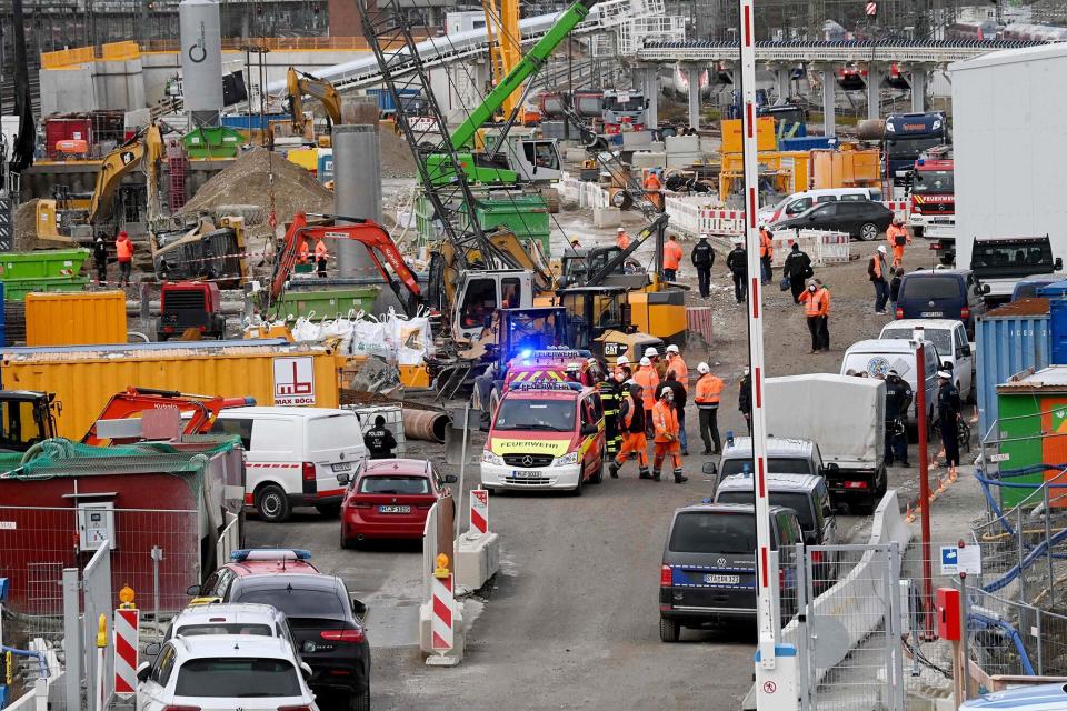 Fire brigades and policemen work at the site of a bomb explosion close to the main railway station in Munich, southern Germany, on December 1, 2021. - According to media reports, four persons were injured, one of them seriously, when a Word War II bomb exploded as works were under way at a construction site close to the railway station. (Photo by CHRISTOF STACHE / AFP) (Photo by CHRISTOF STACHE/AFP via Getty Images)