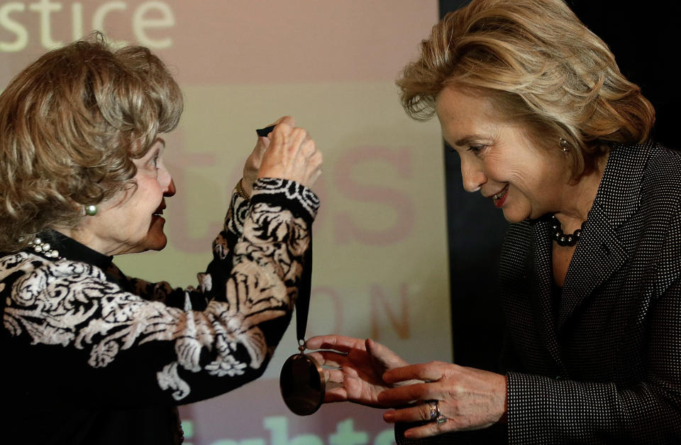 WASHINGTON, DC - DECEMBER 06:  Former U.S. Secretary of State Hillary Clinton (R) is presented the 2013 Tom Lantos Human Rights Prize by Annette Lantos (L) December 6, 2013 in Washington, DC. Clinton received the award for her work in the areas of women's rights and internet freedom.  (Photo by Win McNamee/Getty Images)